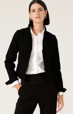 FRONT ZIP PEPLUM JACKET IN BLACK